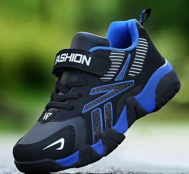 A pair of kids' sport sneakers with a black and white design, featuring a lace-up closure and the word 'FASHION' printed on the side.
