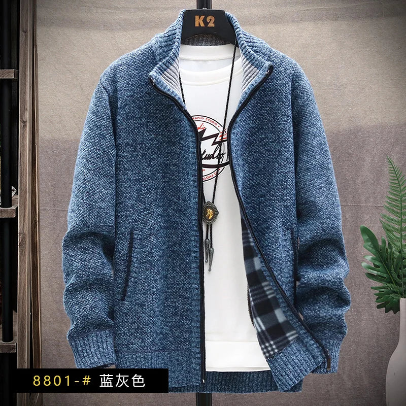 Blue knitted jacket on a mannequin against a neutral background