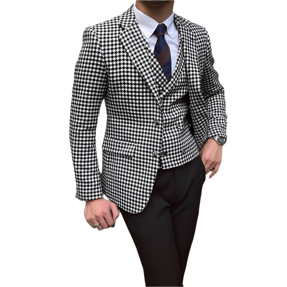 Black and white checkered suit jacket with a vest and pants on a white background