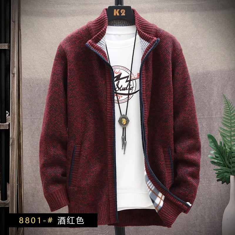 Red sweater on a mannequin with a white shirt underneath, against a gray background.
