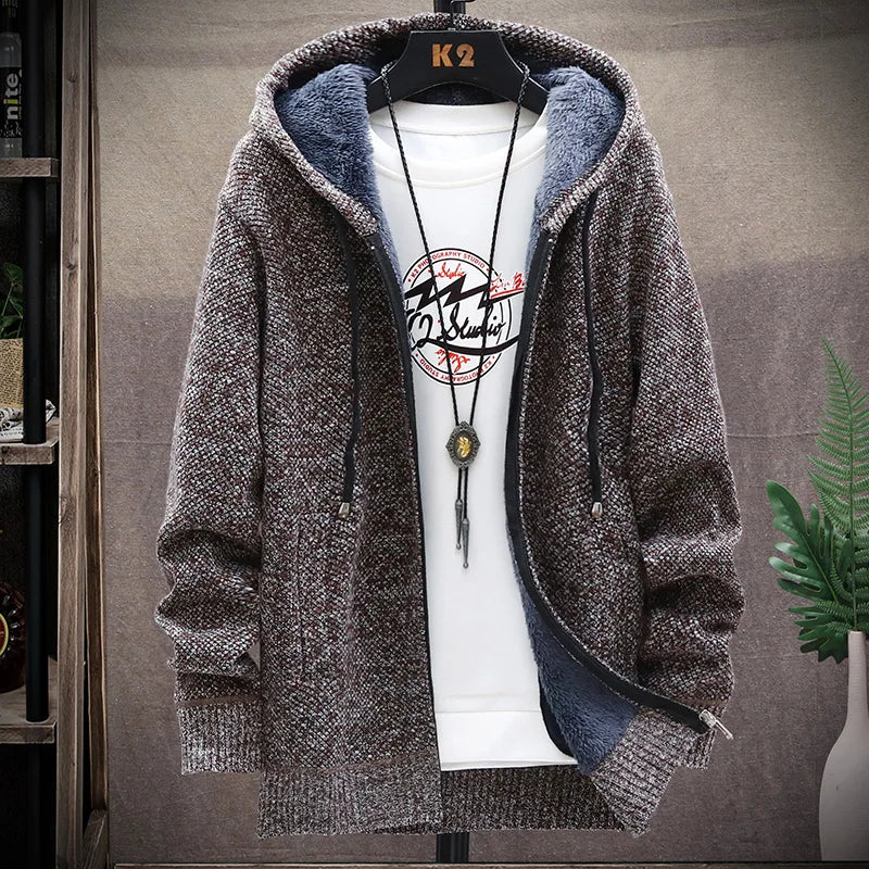Brown hooded jacket on a mannequin with a white shirt underneath, against a neutral background.