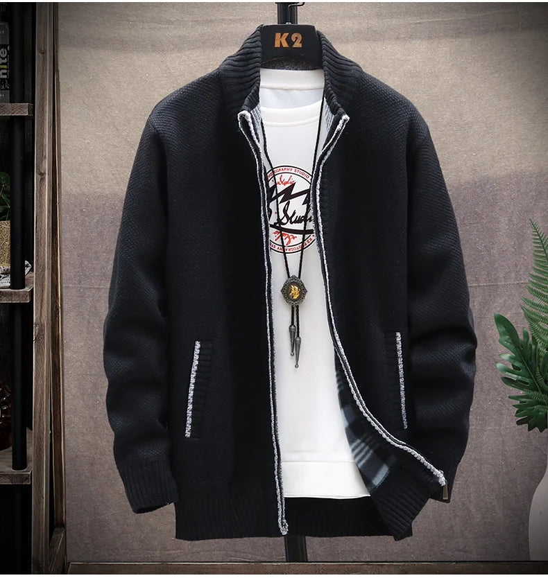 Black jacket on a mannequin with a white shirt underneath, against a neutral background.