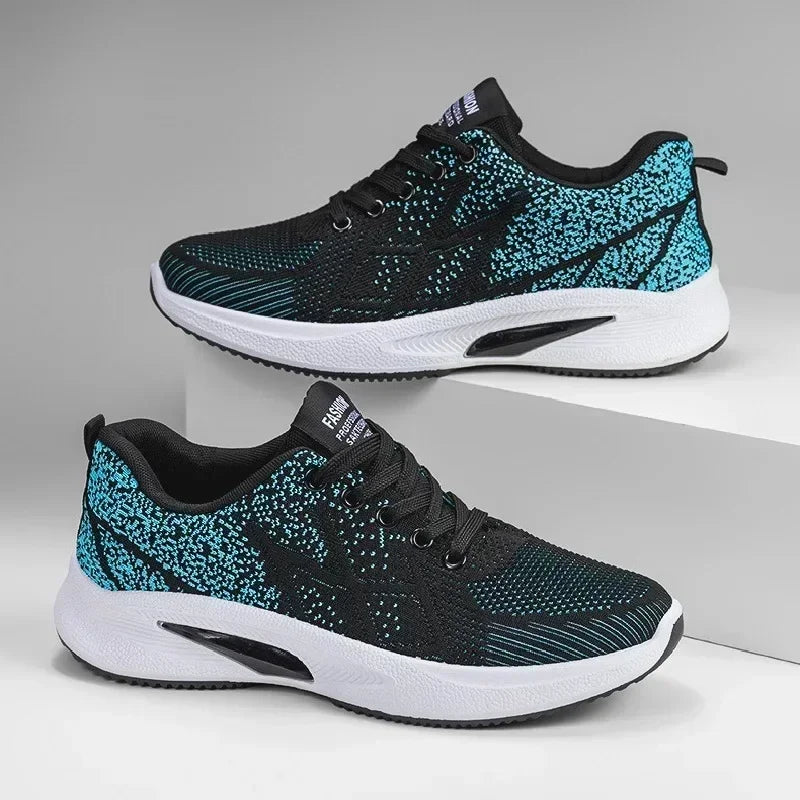 Black and blue Men’s Casual Slip-On Sneakers on a gray background