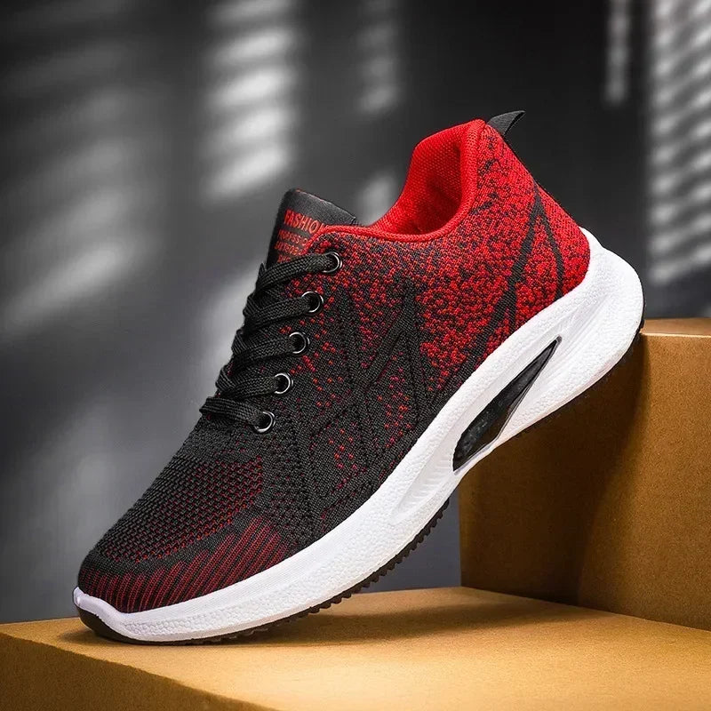 Black and red Men’s Casual Slip-On Sneakers with white sole on a brown platform against a dark background