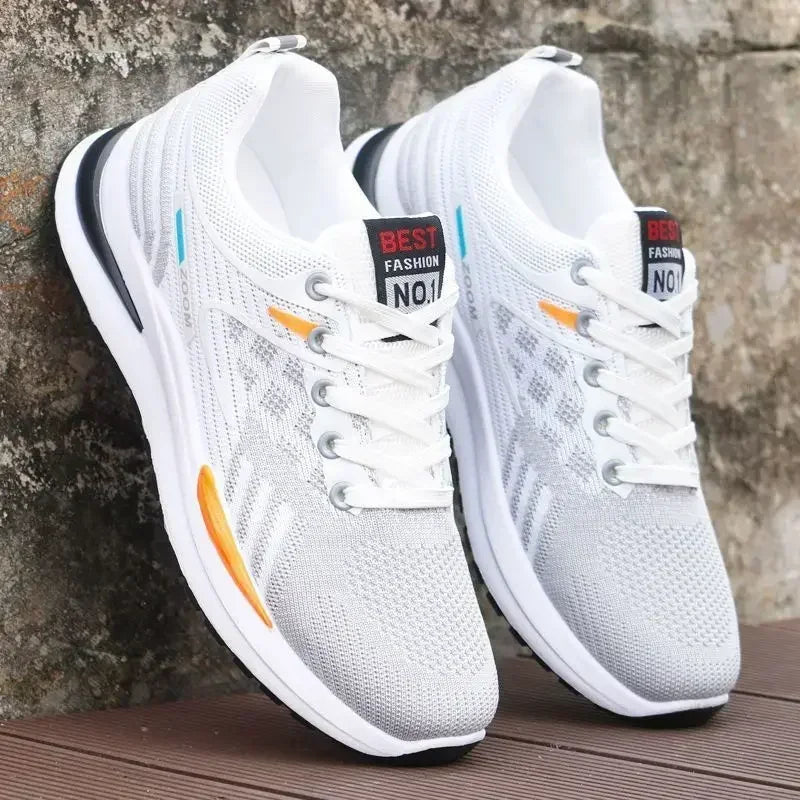 White Men’s Casual Slip-On Sneakers with colorful accents on a wooden surface and stone wall background