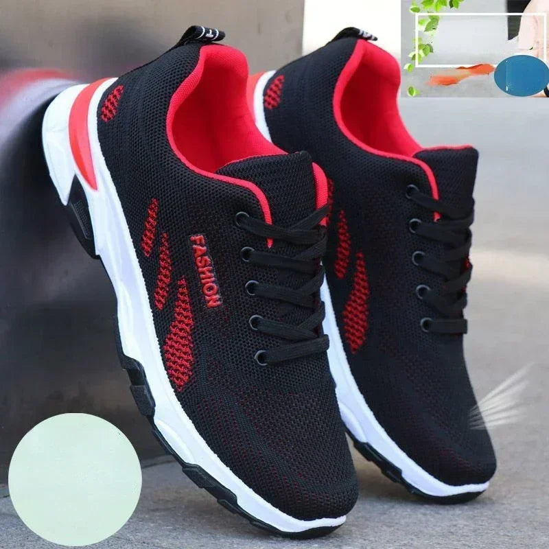 Black and red Men’s Casual Slip-On Sneakers with white soles on a blurred background