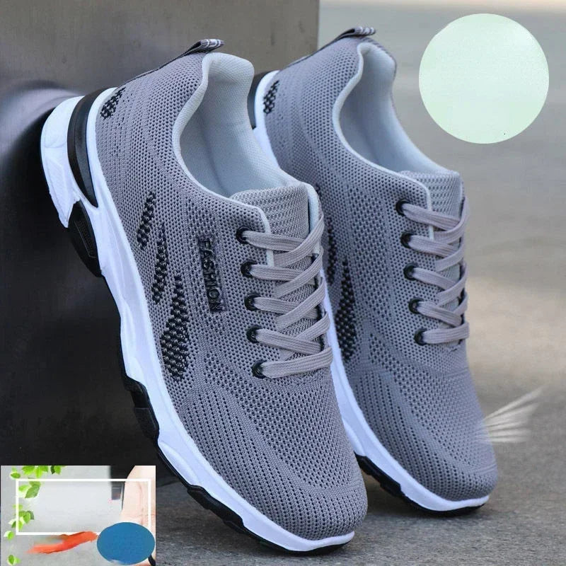 Gray Men’s Casual Slip-On Sneakers with black accents on a gray background