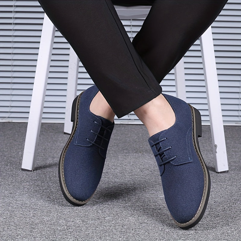 Blue shoes worn with black pants on a neutral background