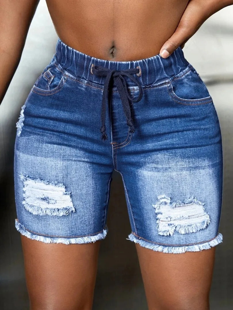 Blue ripped denim shorts for women, stylish and casual summer wear.