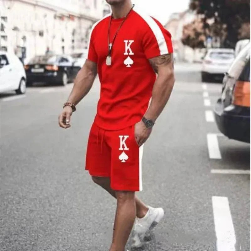 Person wearing a red outfit with a 'K' logo on a city street.