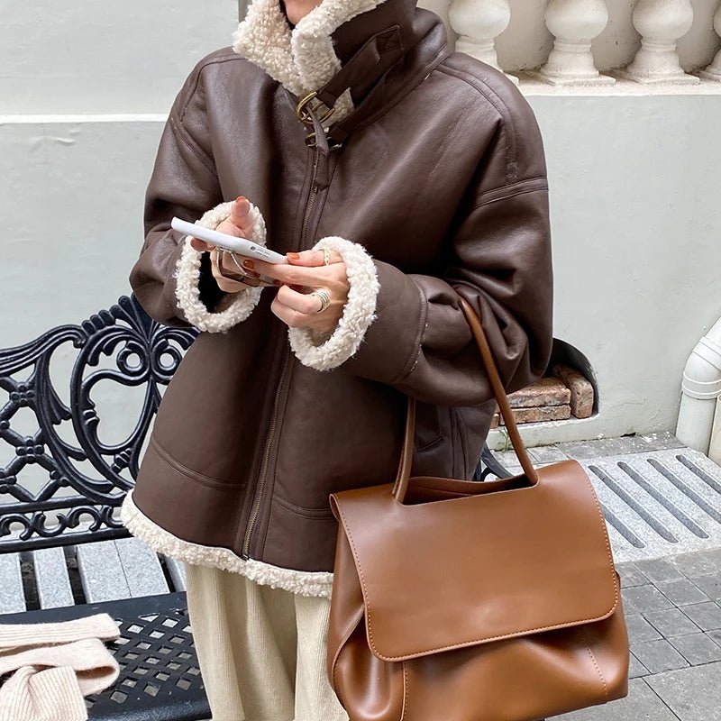 Stylish Women's Faux Leather Jacket with a classic design, zippered front, and premium faux leather material.